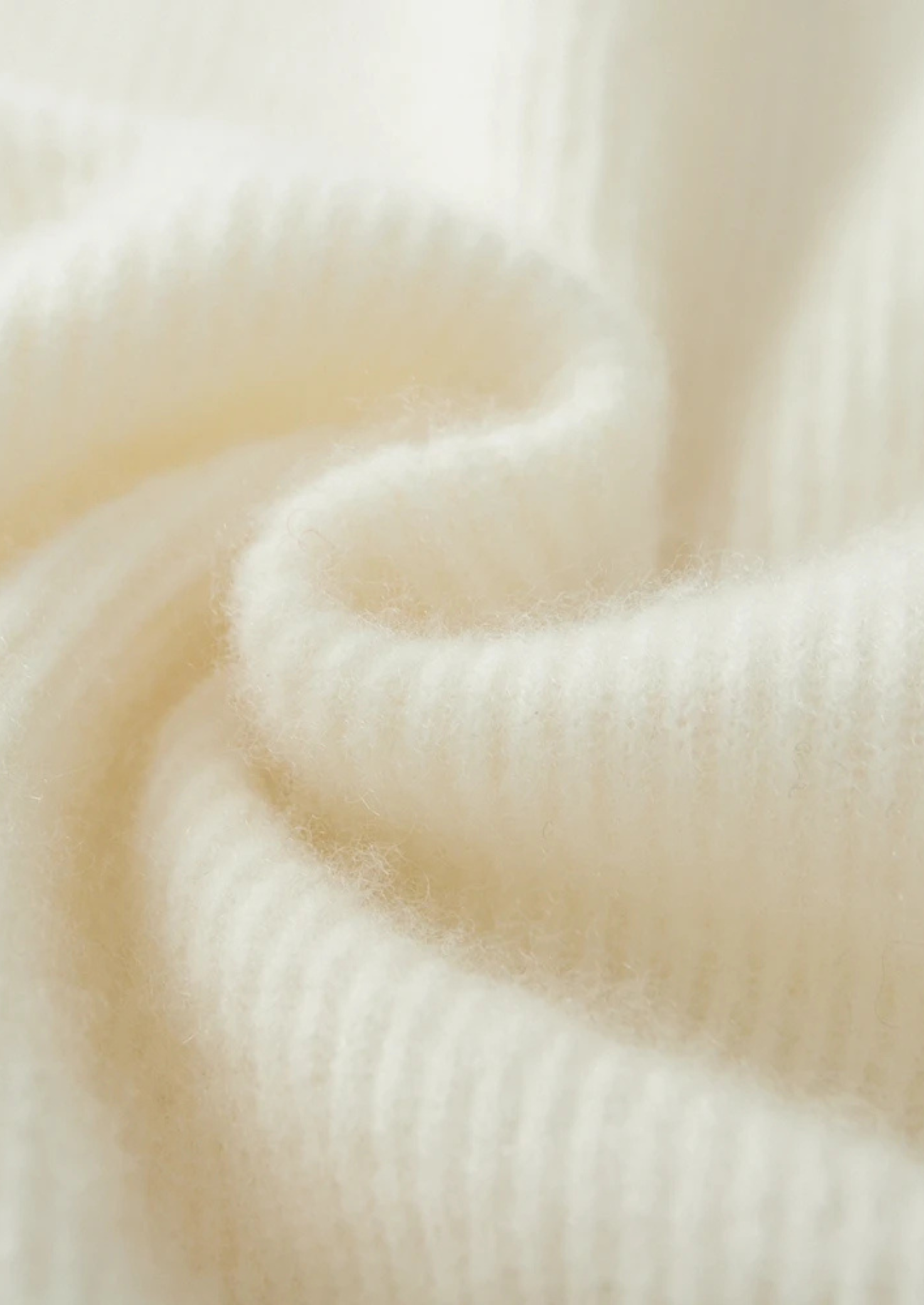 Cárdigan de lana con punto canalé y cremallera frontal