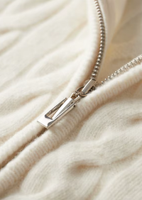 Cárdigan de lana con doble cremallera y punto cable