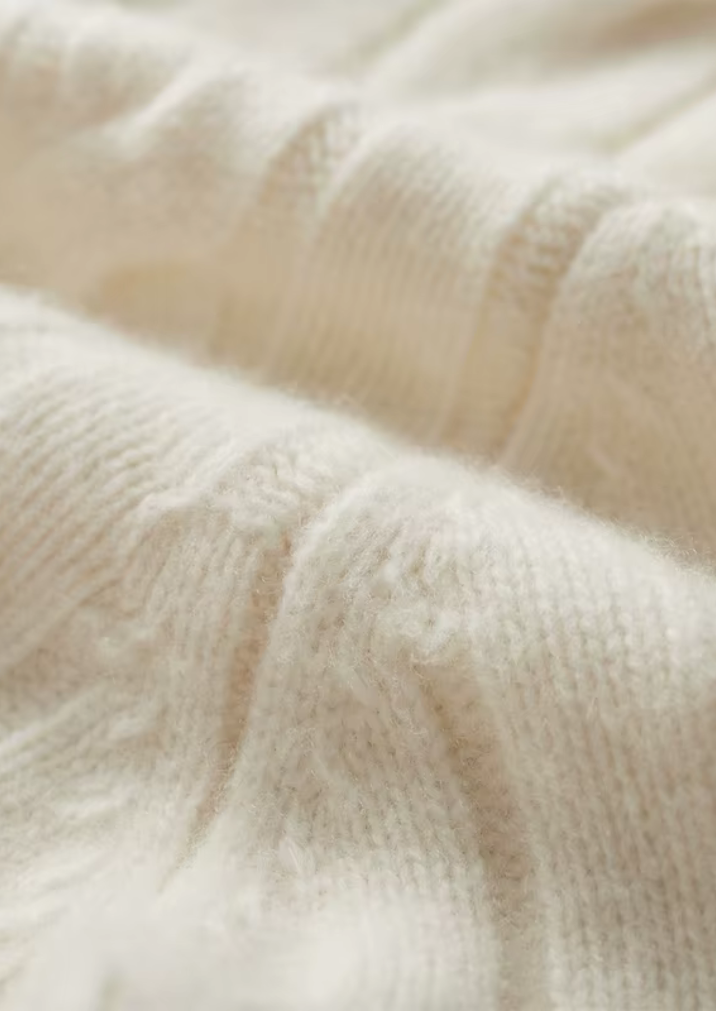 Cárdigan de lana con doble cremallera y punto cable