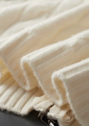 Cárdigan de lana con doble cremallera y punto cable