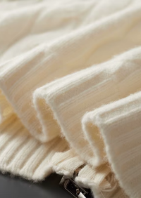 Cárdigan de lana con doble cremallera y punto cable