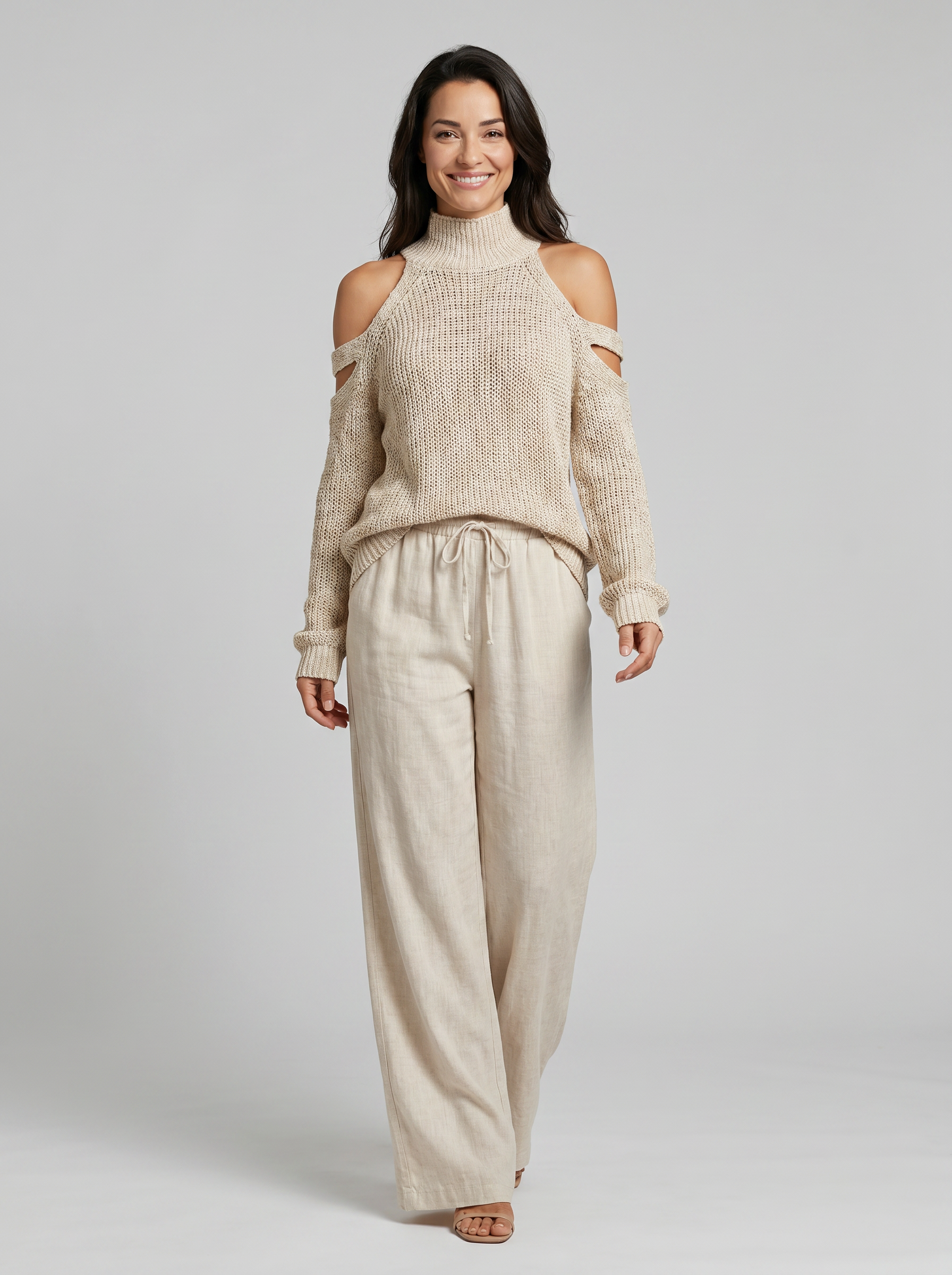 Ensemble pull à col roulé beige en maille avec épaules dénudées et pantalon large