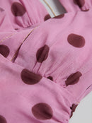 Robe longue dos nu à pois avec lien à la taille